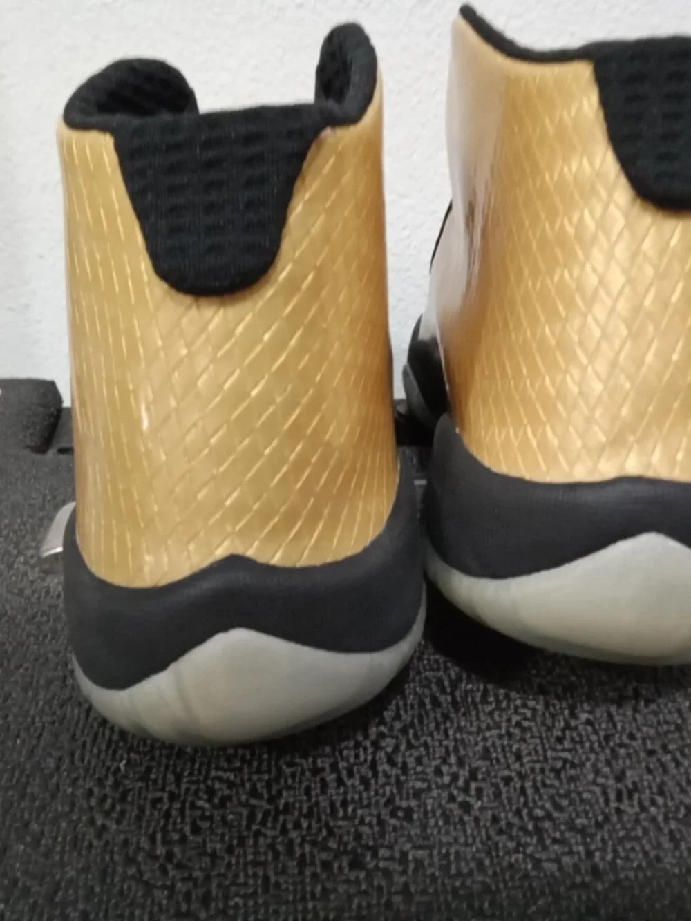 Air Jordan Future sneakers in Metallic Gold and Black, men’s size 7.